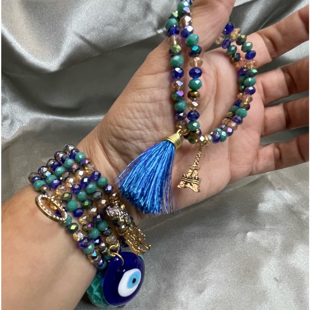 Crystals beaded bracelets with gold plated charms.